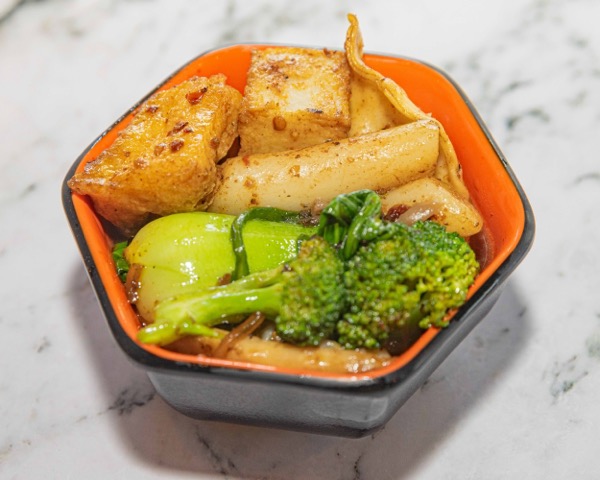 Mushroom broth delivery bowl with mixed mushrooms and vegetables