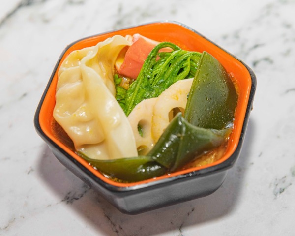 Sukiyaki broth delivery bowl with tofu, vegetables and savory ingredients