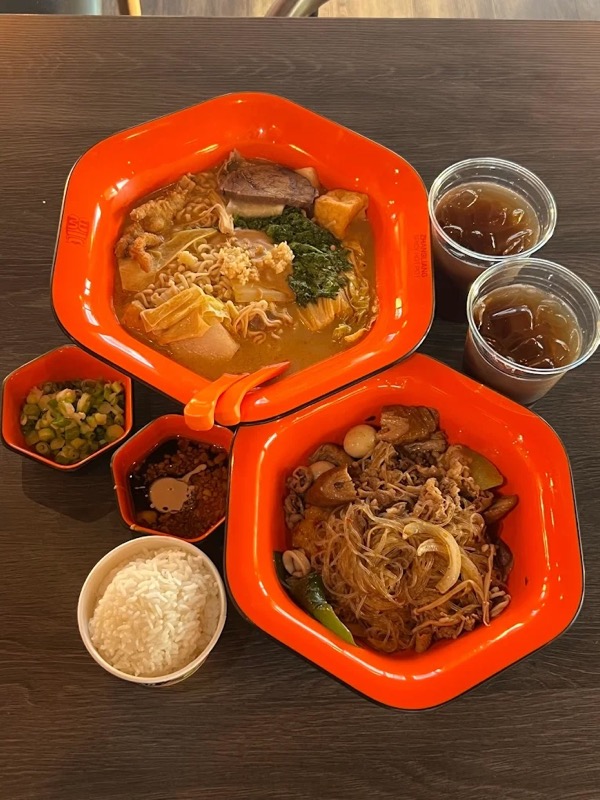 Delicious malatang bowls with noodles, fresh vegetables, and rich broth at Fire Wok Hot Pot